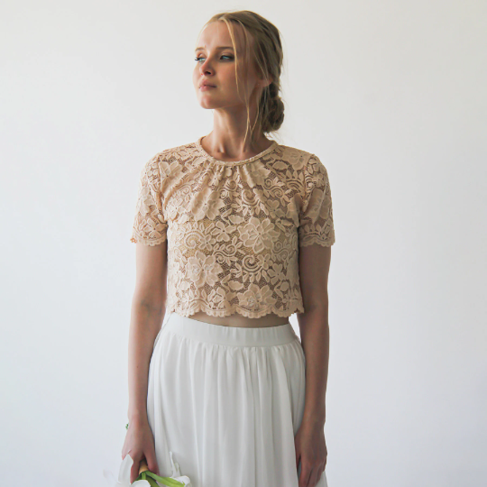 Woman wearing Meluvia bridal lace top and ivory chiffon skirt, showcasing modern and romantic bridal fashion.