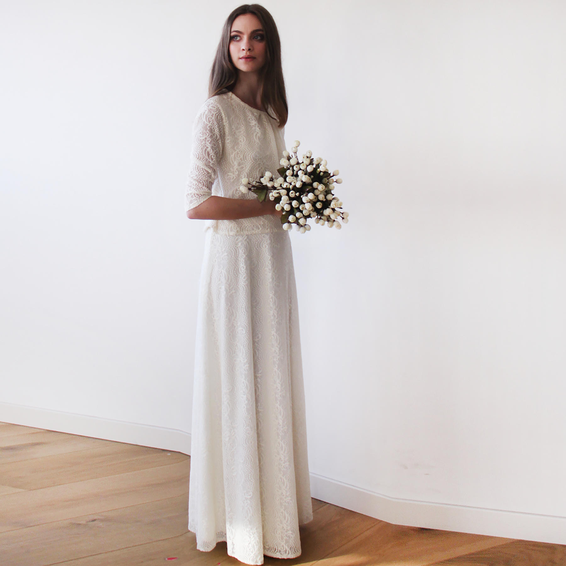 White lace bridal maxi skirt with floral bouquet, showcasing elegant and timeless design for modern brides seeking comfort and style.