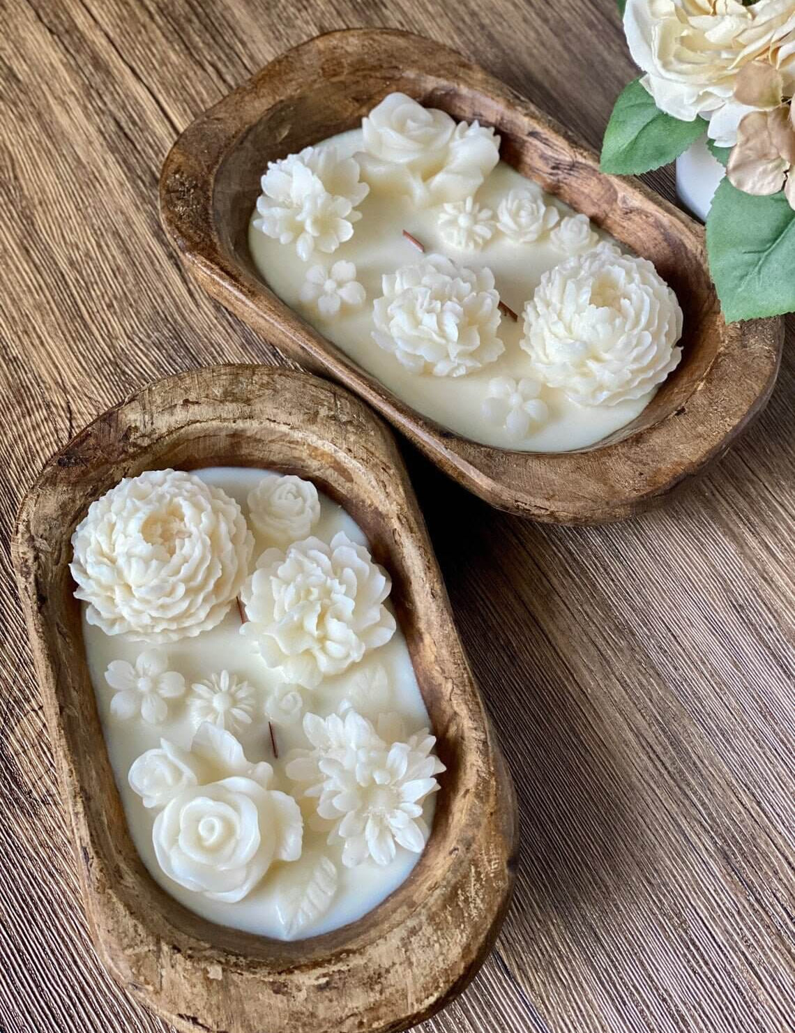 Hand-carved wooden bowl with botanical-themed soy candle and floral embellishments, perfect for weddings or home decor.