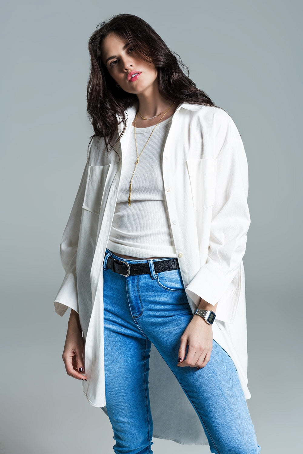 Woman wearing Naeryn Boyfriend Shirt with 3/4 sleeves and relaxed fit, styled with jeans and casual top in a neutral setting.