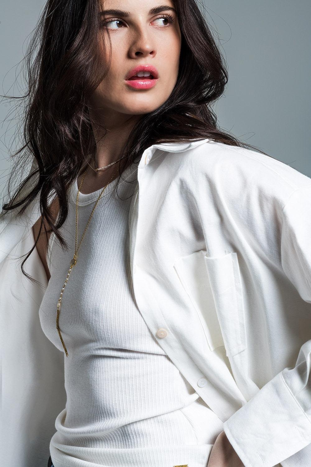 Woman wearing Naeryn Boyfriend Shirt with 3/4 sleeves and a relaxed fit, showcasing feminine menswear style.