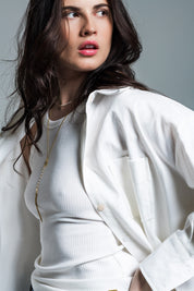 Woman wearing Naeryn Boyfriend Shirt with 3/4 sleeves and a relaxed fit, showcasing feminine menswear style.