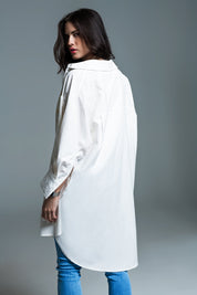 Woman wearing Naeryn Boyfriend Shirt with 3/4 sleeves, relaxed fit, and classic polo collar in crisp white, styled with jeans.