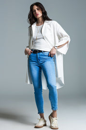 Woman wearing Naeryn Boyfriend Shirt with 3/4 sleeves, relaxed fit in crisp white, styled over jeans and sneakers for a casual look.