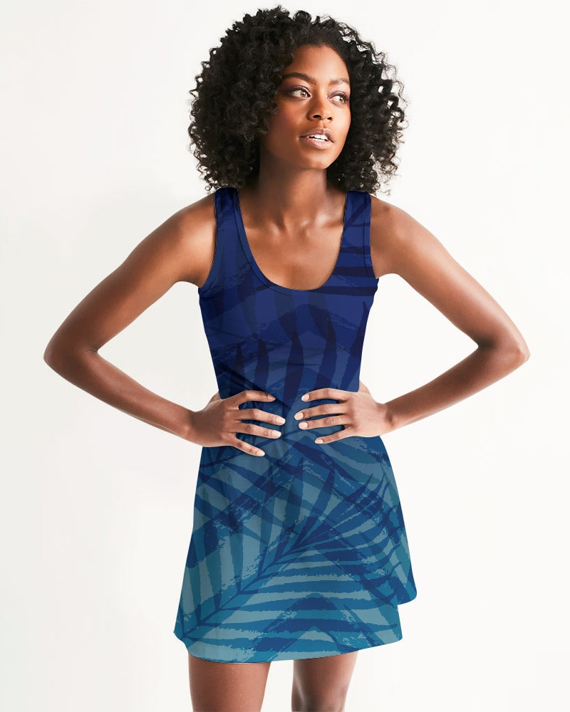 Woman wearing Sunset Hour Racerback Dress with geometric pattern, showcasing a sleeveless design perfect for sunny strolls and summer outings.