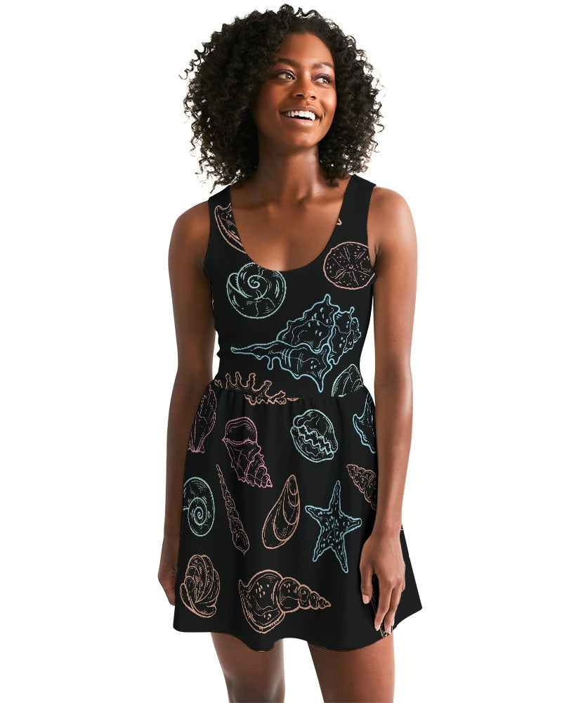 Shelllight Skater Dress with coastal design, featuring a scoop neckline and shirred skirt, worn by a model for a casual beachwear look.