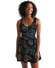 Shelllight Skater Dress with coastal design, featuring a scoop neckline and shirred skirt, worn by a model for a casual beachwear look.