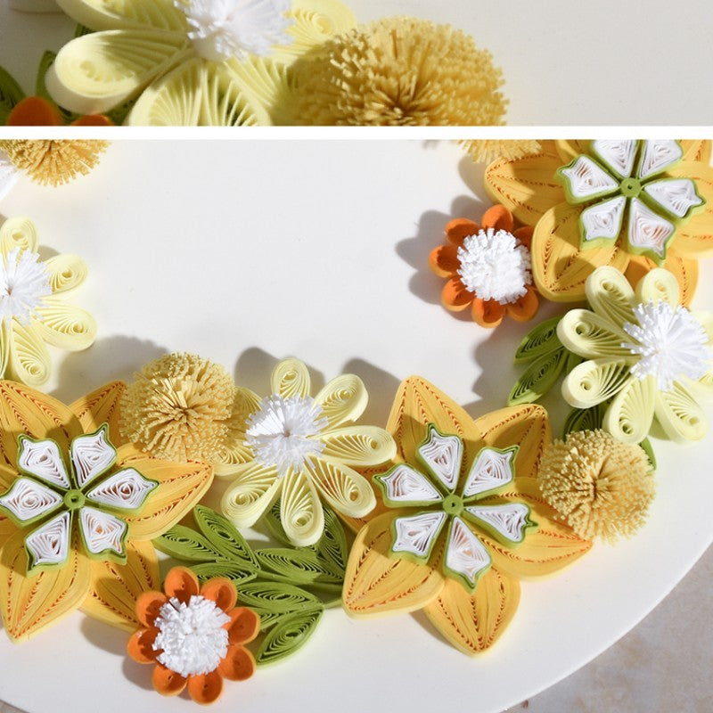 Handmade quilted paper garland featuring colorful floral patterns on craft paper, perfect for creative home décor and art enthusiasts.