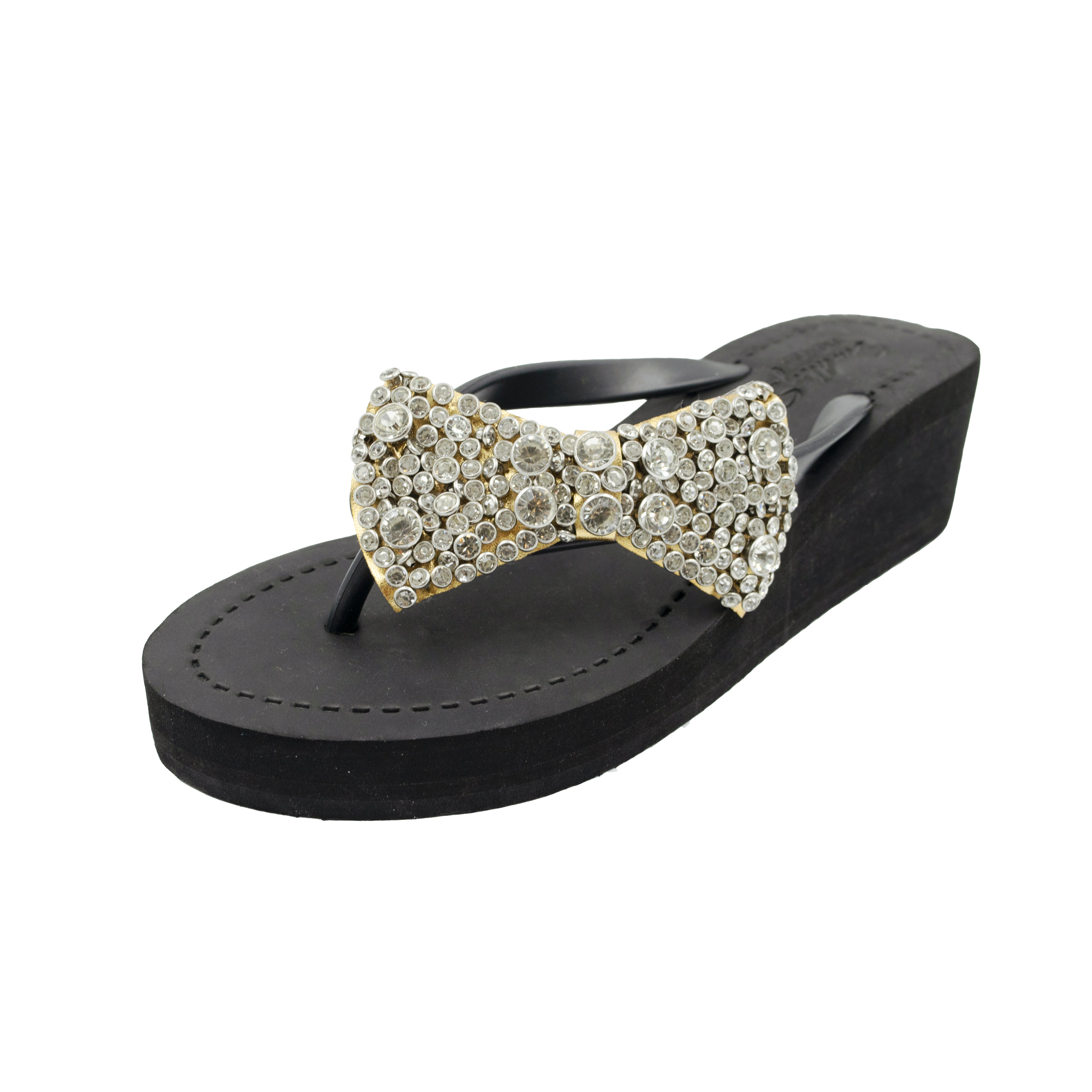 Celestina Bow Mid-Wedge Sandals with crystal-embellished bow, black mid-height wedge, cushioned vegan leather, festive summer footwear