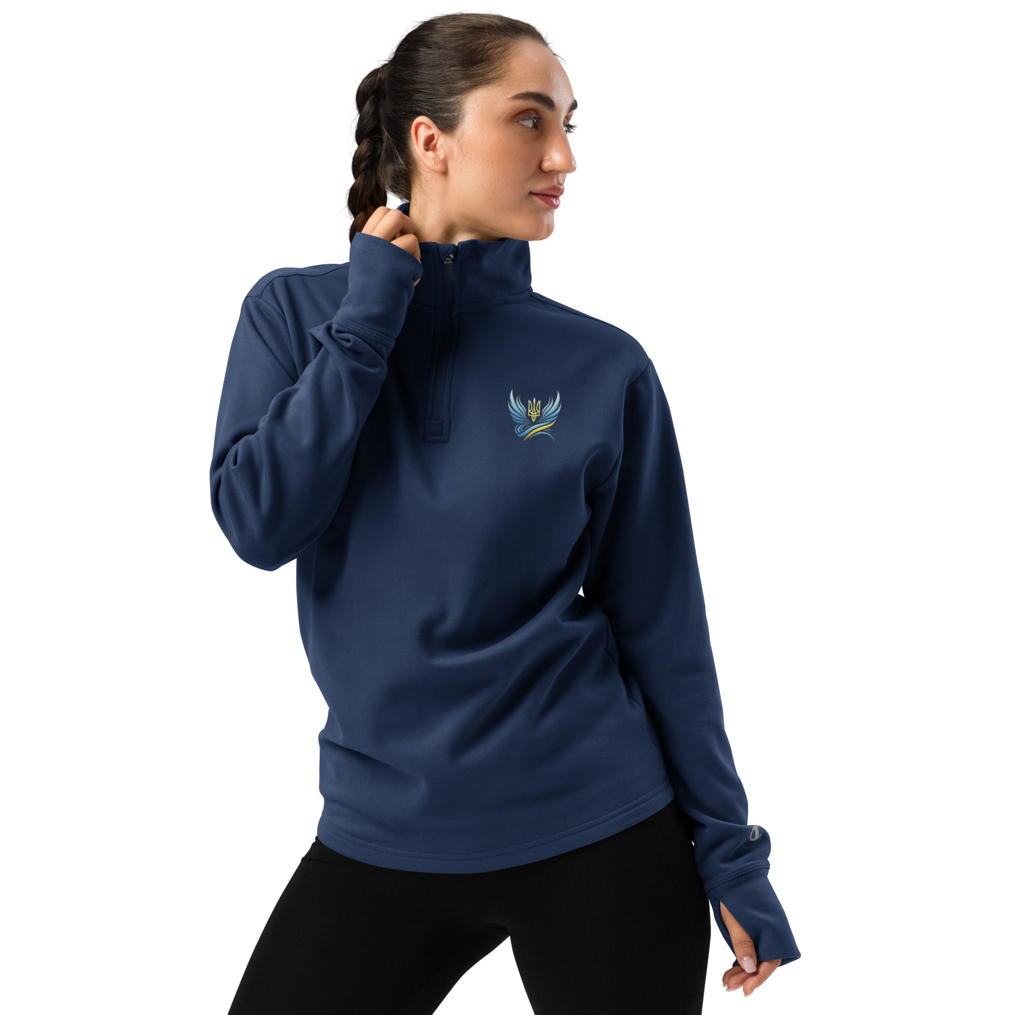Woman wearing Ukrainian Vibe Trizub Collection quarter zip pullover in blue, showcasing athletic fit and sleek design.