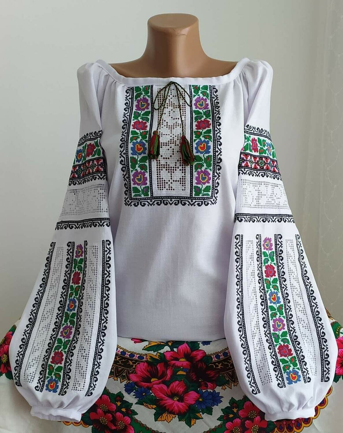 Cotton folk vyshyvanka blouse with traditional Ukrainian embroidery, featuring colorful floral patterns, handmade for women.