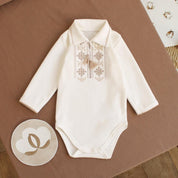 Cream Ukrainian embroidered long sleeve baby onesie with Vyshyvanka design, perfect for special occasions and baby gifts.