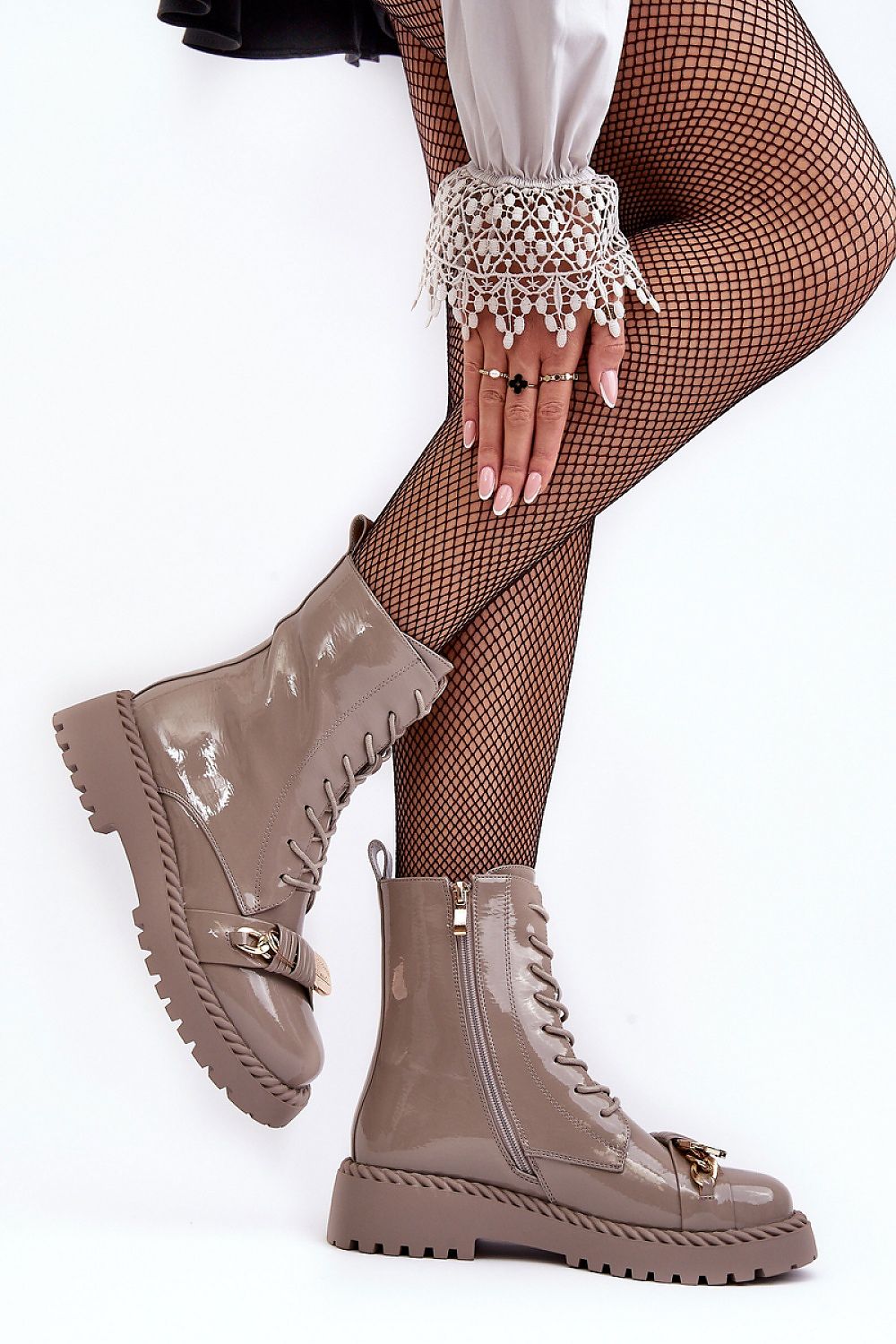 Stylish Jevira Gold-Trim Platform Boots with eco leather and gold accents, featuring a side zipper and insulated lining for warmth.