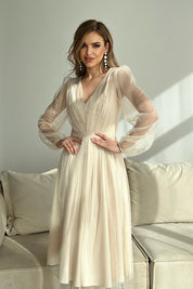 Woman wearing Marleia Mesh-Layered Evening Midi Dress with sheer sleeves, shimmering brocade mesh, and elegant flared skirt.