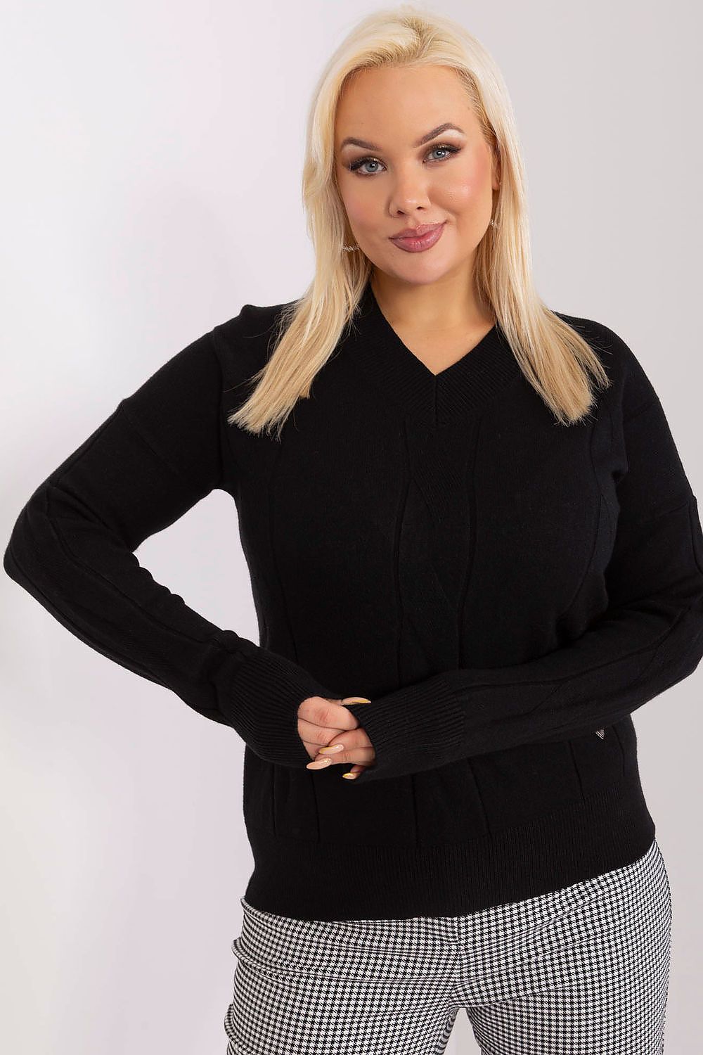 Woman wearing Plus Size Mirella Textured Knit Sweater in black, showcasing cozy and elegant style for office or casual outings.
