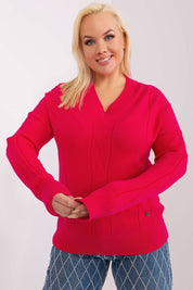 Woman wearing Plus Size Mirella Textured Knit Sweater in bright pink with long sleeves.