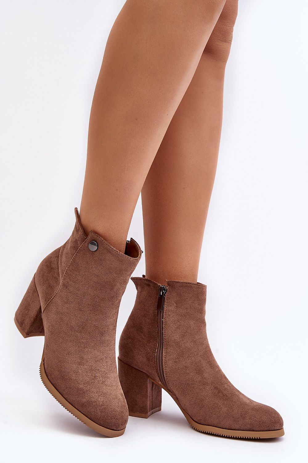 Brown eco suede ankle boots with zipper and chunky heel, featuring a rounded toe and warm lining, showcasing elegant style and comfort.