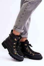 Larkwood Leather Winter Trapper Boots with durable leather exterior and lace-up design, worn with rolled-up jeans for a stylish look.