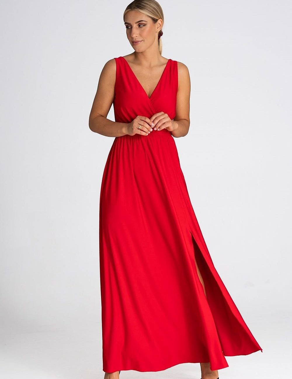 Model wearing Delvanna V-Neck Maxi Dress with slit, front view showcasing elegant style and deep V-neckline.