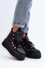 Ermelle Sculpted Platform Sneakers in black leather, featuring bold platform, rounded toe, and high upper for stability and comfort.
