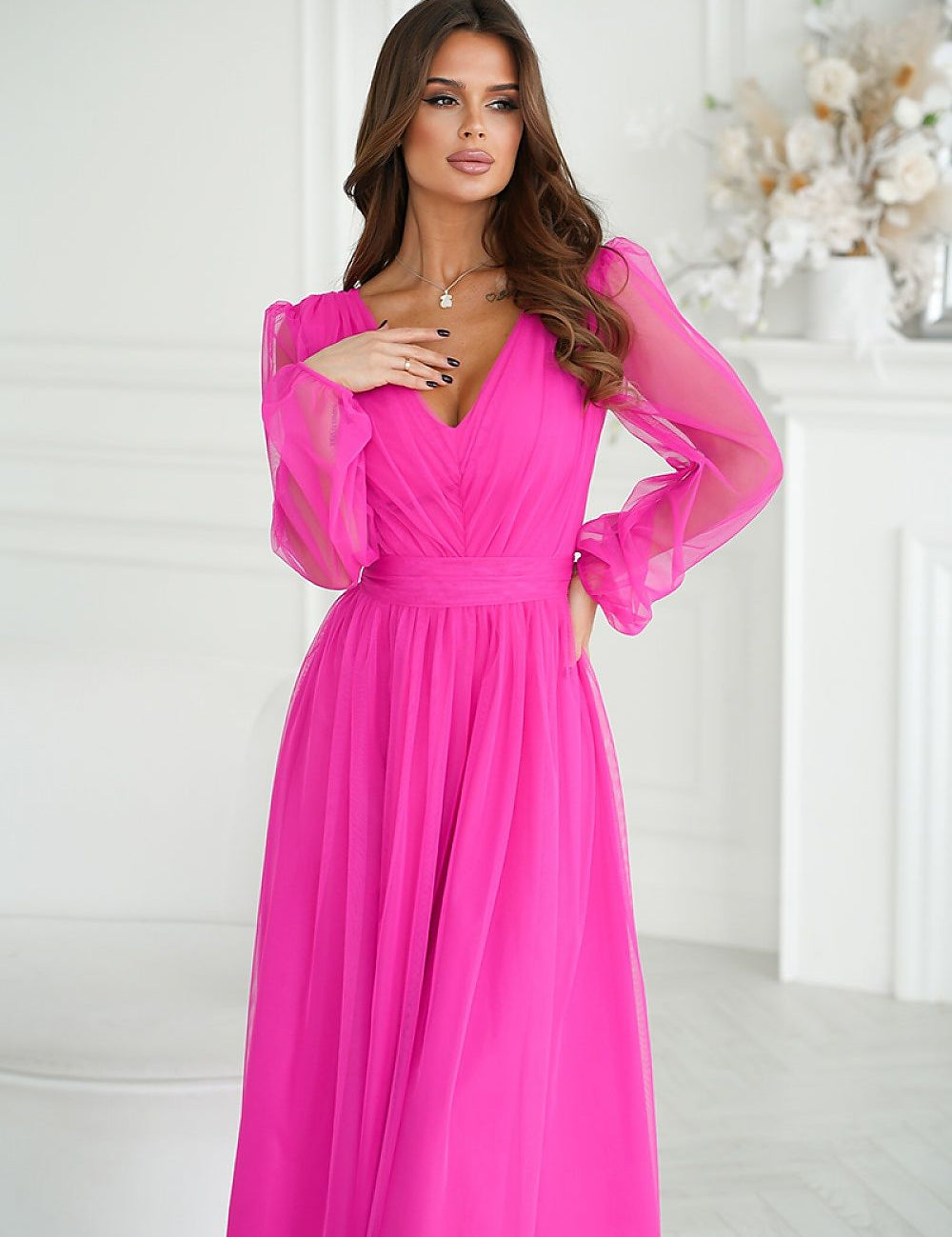Woman wearing Marleia Mesh-Layered Evening Midi Dress in vibrant pink with sheer mesh sleeves and brocade mesh skirt.