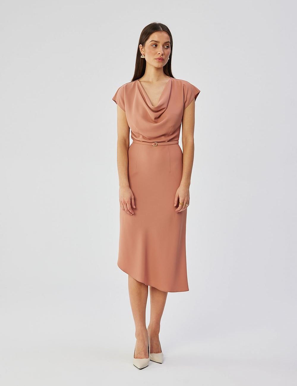 Model wearing the Calerra Asymmetric Midi Pencil Dress with soft water neckline and batwing sleeves on a white background.