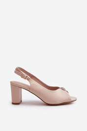 Nivaria ornamented heel strap sandals with eco leather, shimmer detail, and adjustable buckle on a structured heel.