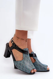 Carelia Buckled Post Heel Sandals in eco leather with adjustable strap and soft insole, offering stable elegance for warm-weather wear.