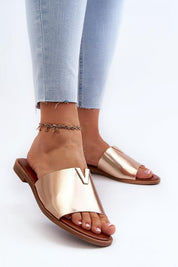 Talvera flat slides with gold detail, crafted from eco leather, featuring a slim heel and minimal design for versatile summer looks.