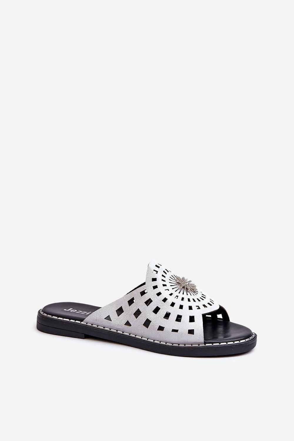Orletta flat slides with cutout details in eco leather, offering breathability and style with a decorative front accent for warm days.