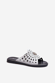 Orletta flat slides with cutout details in eco leather, offering breathability and style with a decorative front accent for warm days.