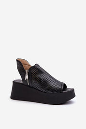 Openwork leather platform sandals with high heel and zipper closure, featuring a bold silhouette and airy pattern for a stylish look.