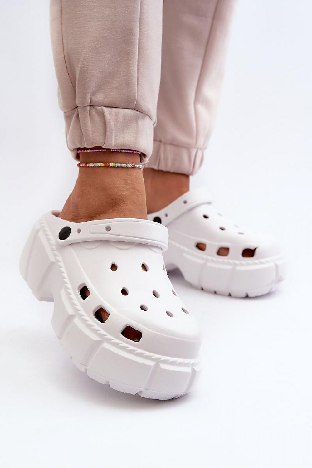 Delvyna Sculpted Foam Beach Slides in white, featuring a thick sole for comfort on sand or pavement. Minimalist summer footwear.