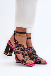 Elianta Crystal Block Heel Sandals with suede-like upper and embellishments, showcasing sculptural elegance and high block heel design.