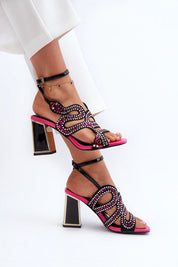 Elianta Crystal Block Heel Sandals with embellished suede-like upper, open design, and high block heel for elegant style.