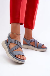 Eravelle Motion Grip Sandals with eco leather uppers and Velcro straps, worn with red pants. Perfect for active days and outdoor walks.