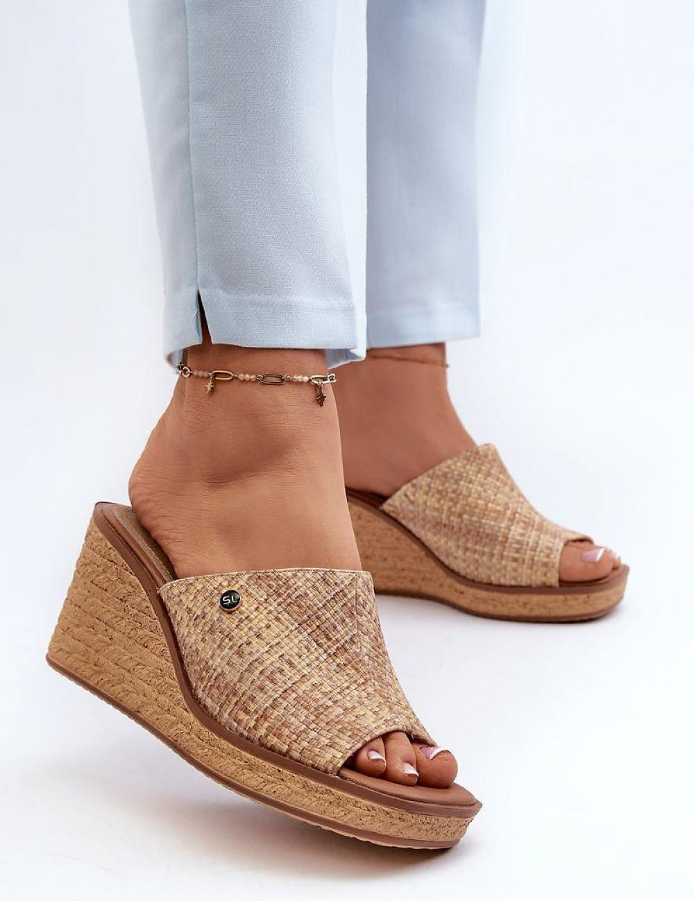Woman wearing Ardeva Braided Wedge Flip-Flops with synthetic upper and leather footbed, showcasing braided platform and stylish summer look.