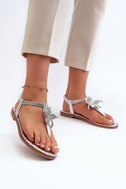 Woman wearing Elavie Blossom Accent Flats with floral details, soft synthetic finish, and open design for summer elegance.