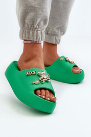 Floriva Thick-Sole Foam Flip-Flops in green with decorative accents, featuring a 5.5 cm platform. Ideal for summer beach days and strolls.