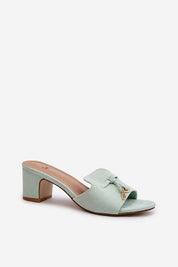 Solvera heeled suede flip-flops in mint green with a 5.5 cm heel, offering a minimalist and elegant summer footwear design.