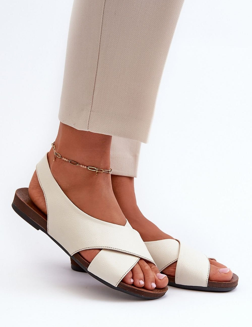 Elegant women's leather sandals, Model 198729, with open heel and toe, flat heel, and soft insole for summer fashion.