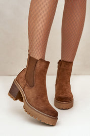 Velmorin brown suede block heel ankle boots with eco-suede finish and side-zip closure, paired with patterned tights for autumn fashion.
