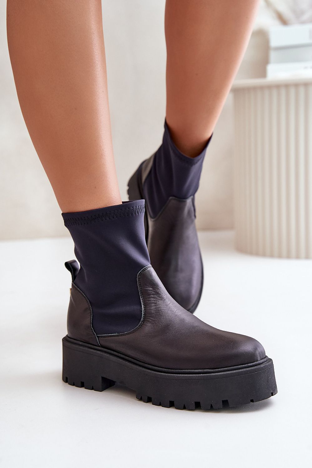 Venire Leather Platform Pull-On Boots in black leather with ankle-high silhouette and flat heel, ideal for casual or tailored outfits.