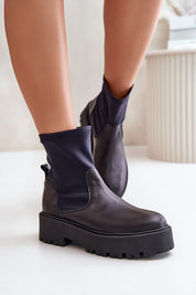 Venire Leather Platform Pull-On Boots in black leather with ankle-high silhouette and flat heel, ideal for casual or tailored outfits.