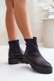 Venire Leather Platform Pull-On Boots with ankle-high silhouette, genuine leather, and stable flat heel for effortless style.