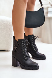 Model wearing Noctera Luxe Zip-Up Heeled Boots with laces, black eco leather, block heel, gold strap, perfect for cold weather.