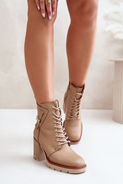 Noctera Luxe Zip-Up Heeled Boots in eco leather with block heel, gold-accented strap, side zip, and insulated lining for warmth.