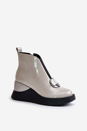 Bravina Platform Ankle Boots in eco leather with side zipper, front elastic, & ornamental detail; perfect for cold weather style and comfort.