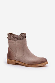Valdera suede ankle boots with cutout detail, featuring flat heel and side zipper for comfort and style. Ideal for everyday wear.