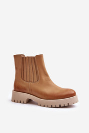 Tan platform boot with block heel, elastic side panel, and rugged sole, perfect for fall and winter fashion and versatility.